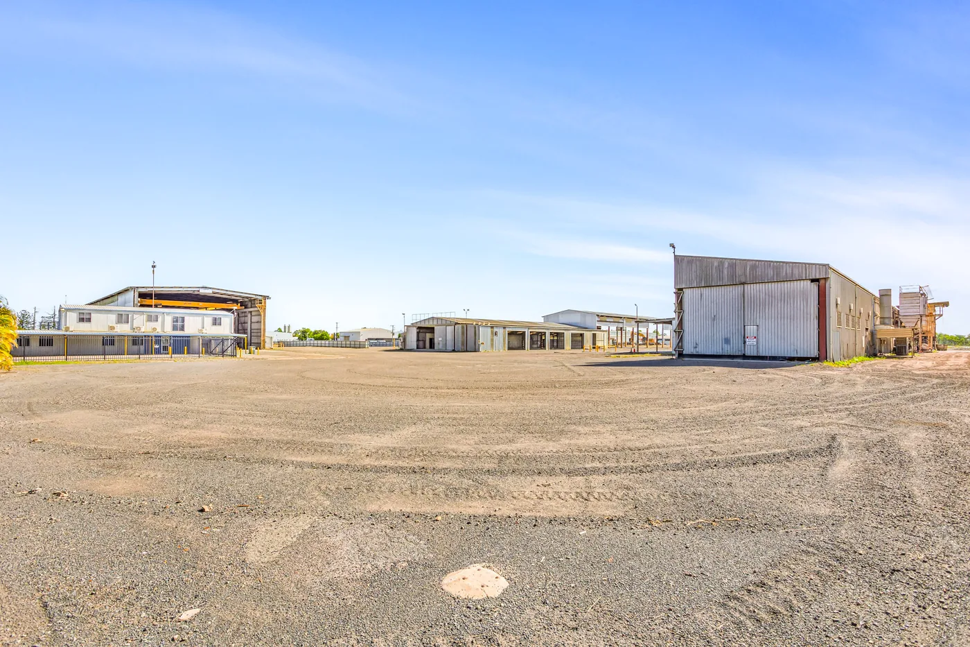Paint and Blast Facility exterior viewed across the broad gravel hardstand