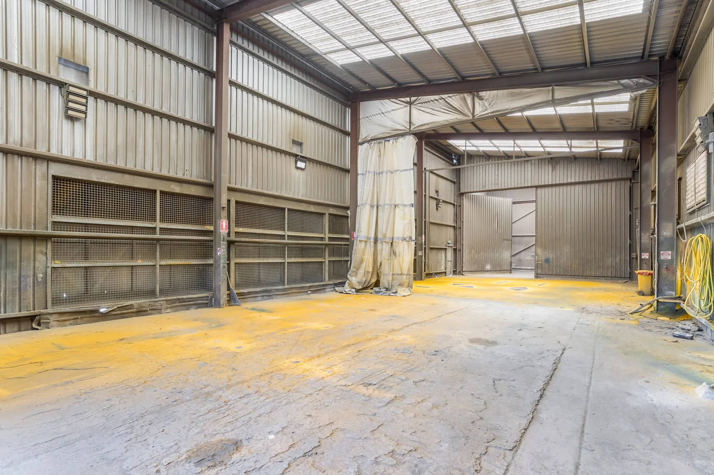 Internal entry between the Paint and Blast Facility work bays