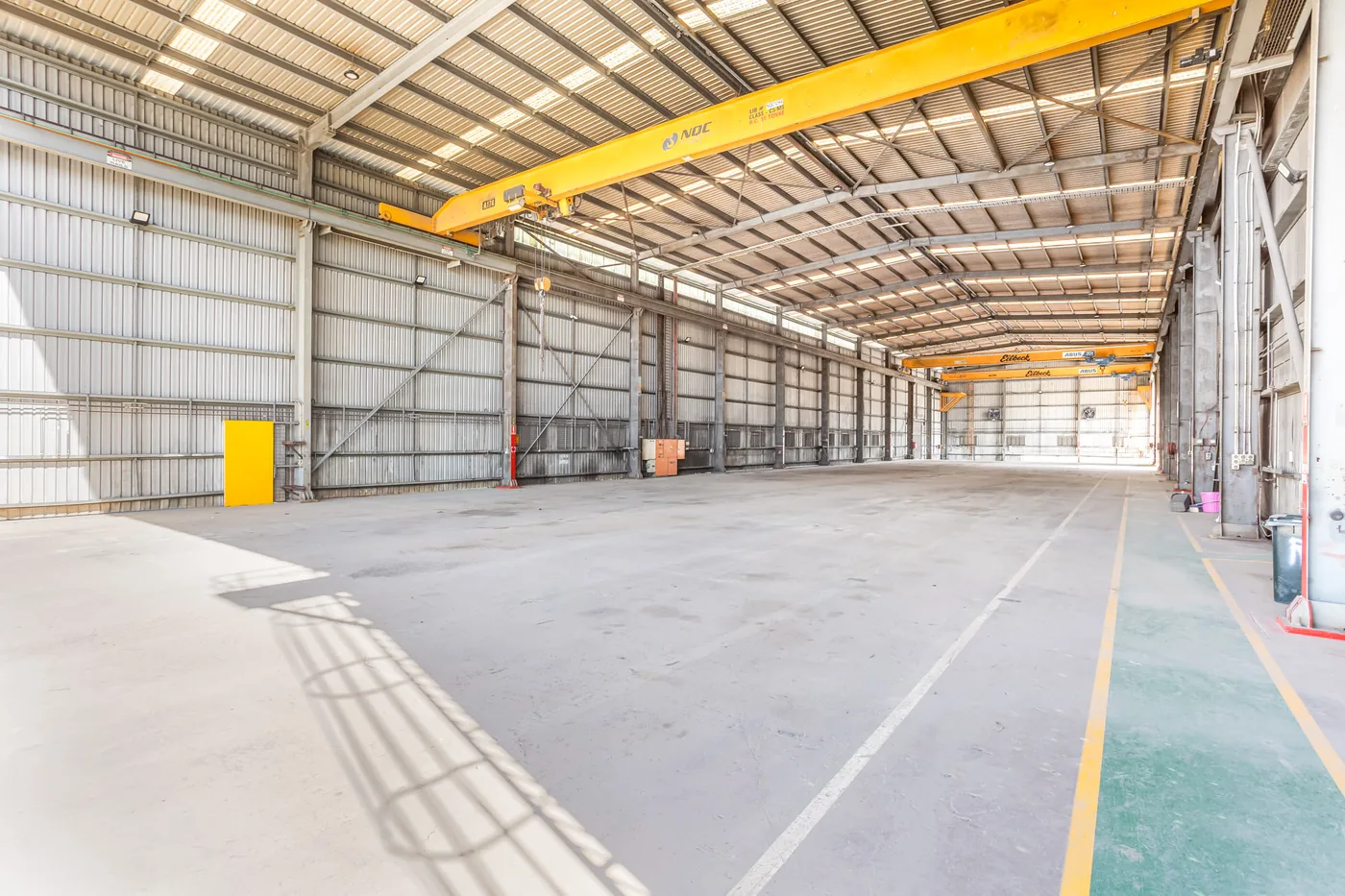 Interior of the Main Crane Shed with yellow overhead gantry cranes