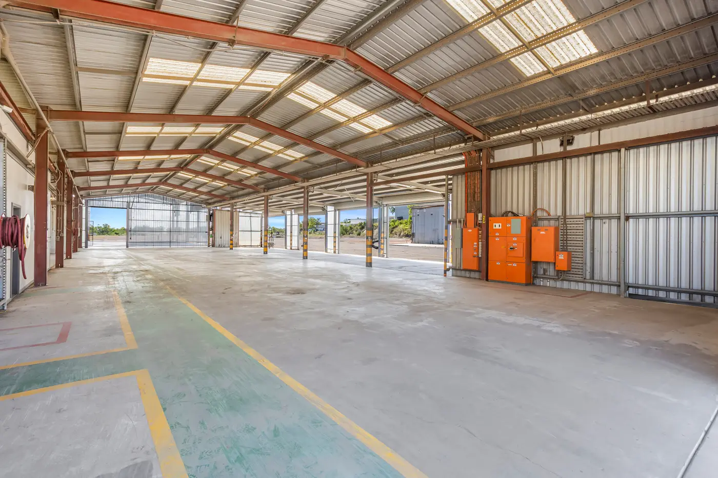 Inside the Mechanical Shed showing open-span workshop bays and roller-door access